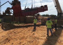 Yoe Construction team members manage crane lift on mining site