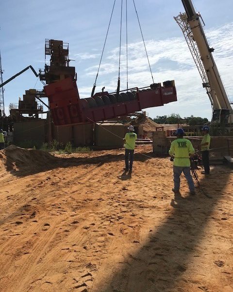 Yoe Construction team members manage crane lift on mining site